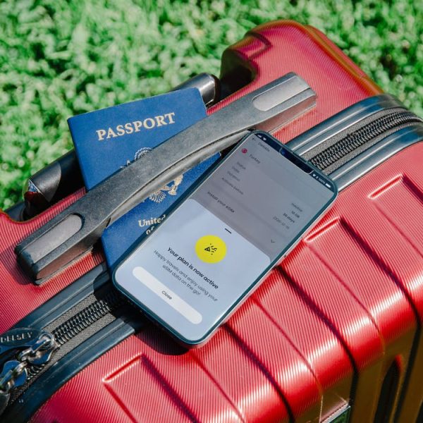 free-photo-of-smartphone-and-passport-on-suitcase