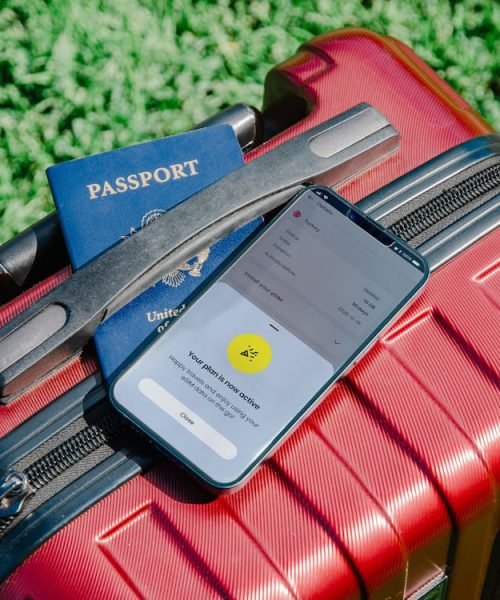 free-photo-of-smartphone-and-passport-on-suitcase